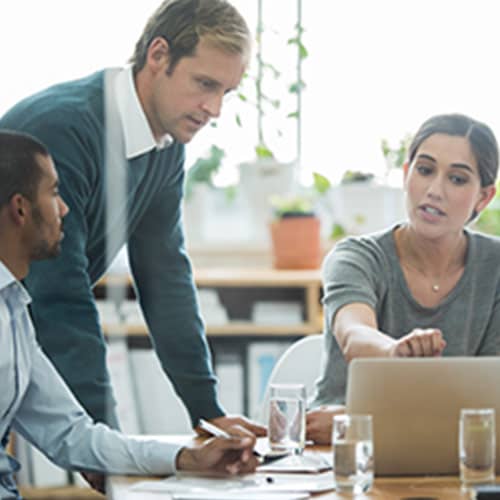 People looking at a laptop