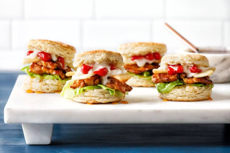 4 mini burgers on a plate