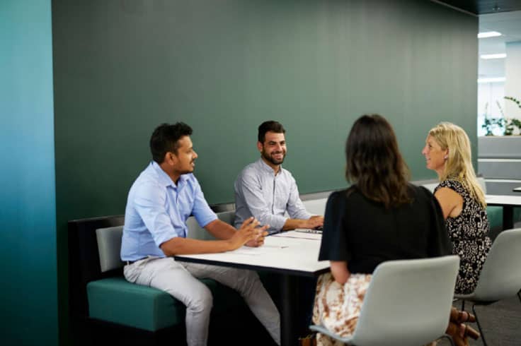 Simplot employees in a meeting