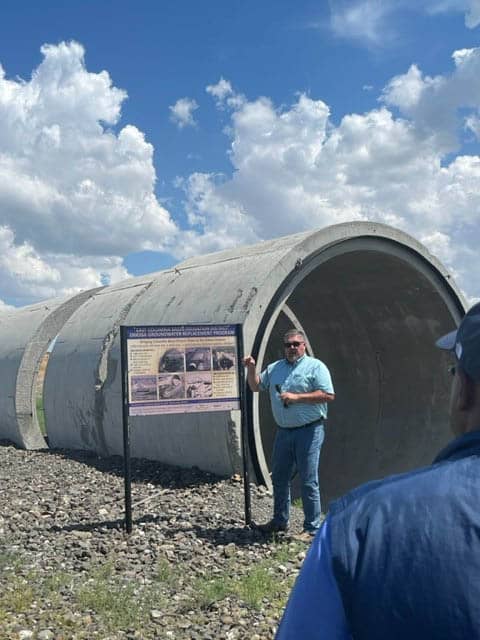 Guy in Front of Large Pipe