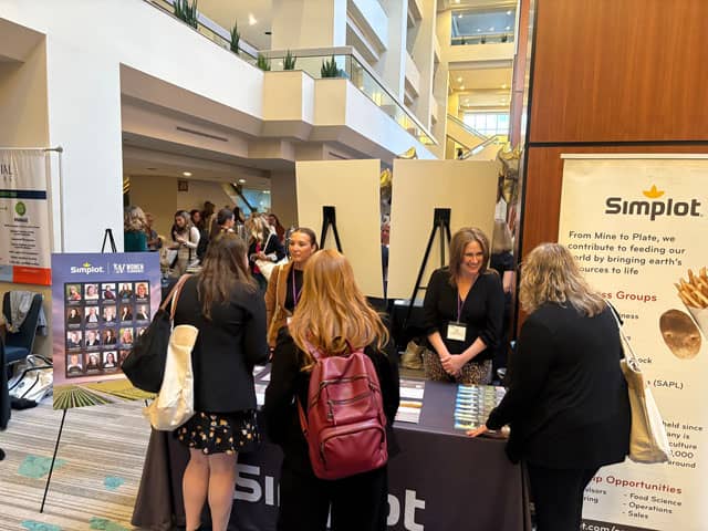 Simplot employees staff the Company booth at WIA