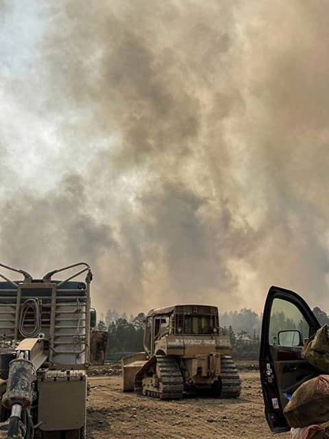 Bulldozer constructing a fire line