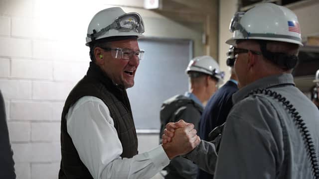 Garrett Lofto greets a friend at the Rock Springs plant